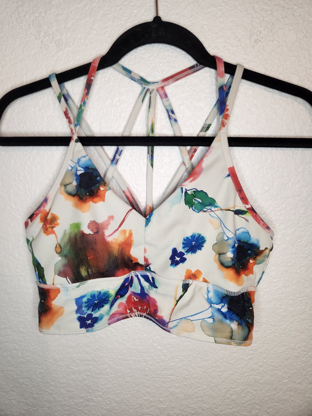 Born Primitive warrior sports bra in a watercolor floral pattern L